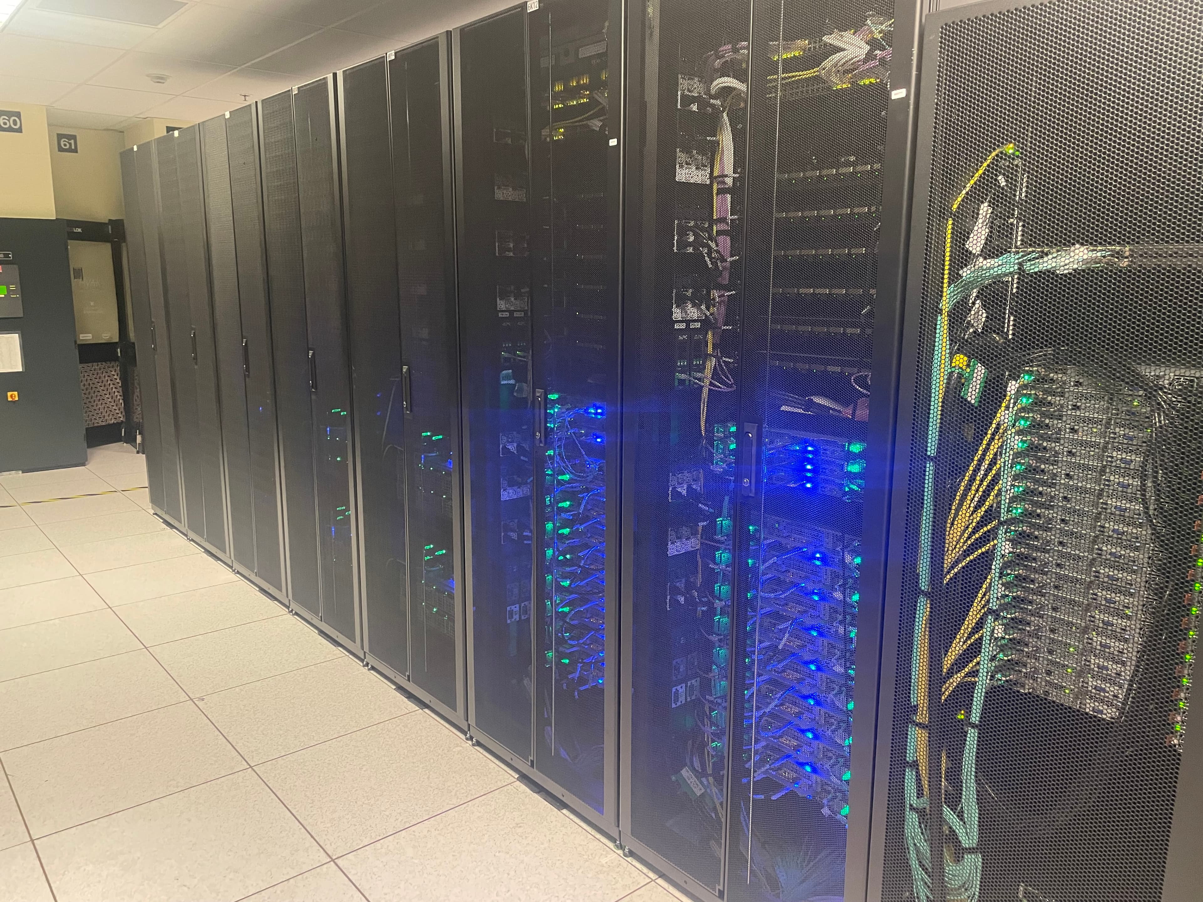 GPU-accelerated server racks representing the cloud and semiconductor infrastructure behind the AI investment cycle