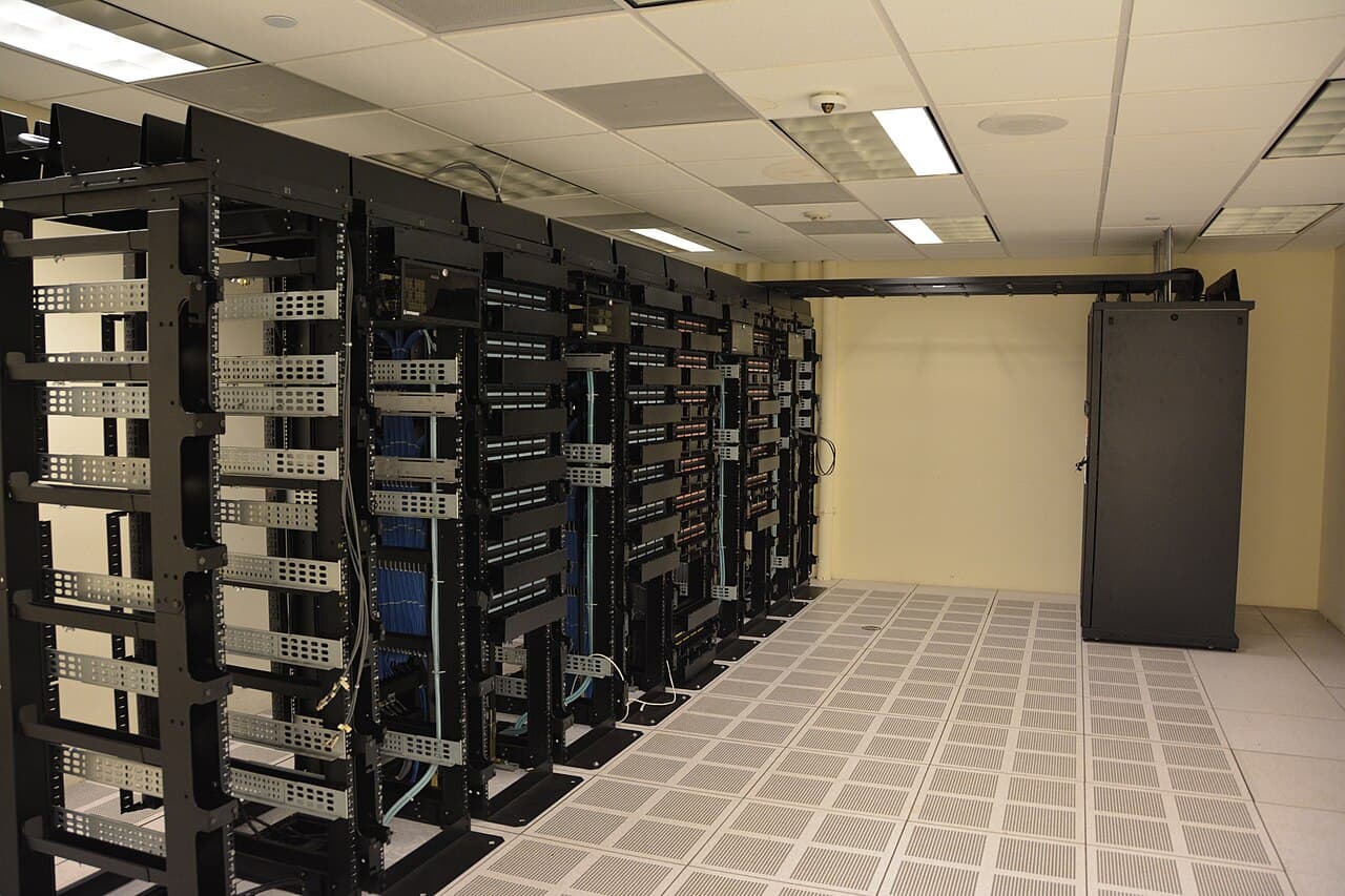Rows of data-center server racks representing the AI infrastructure and semiconductor stocks in the Monday market outlook